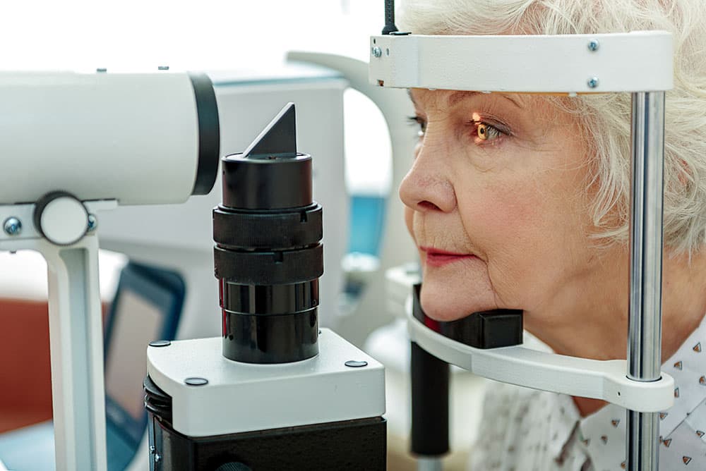 A woman getting her eye examined for cataracts