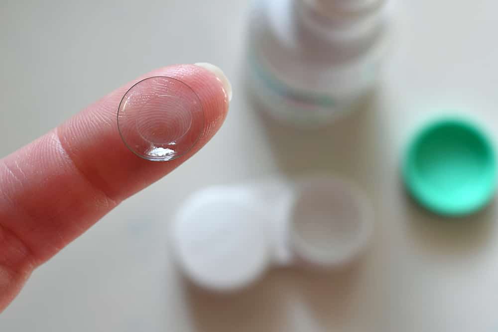 Holding a contact lens with solution
